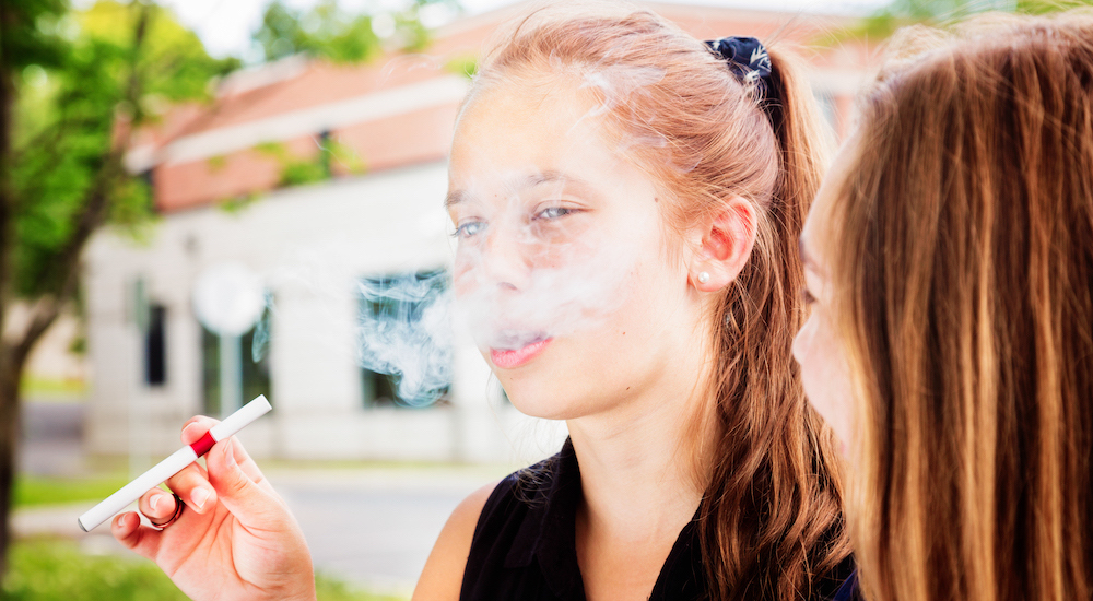 girl vaping e-cigarette