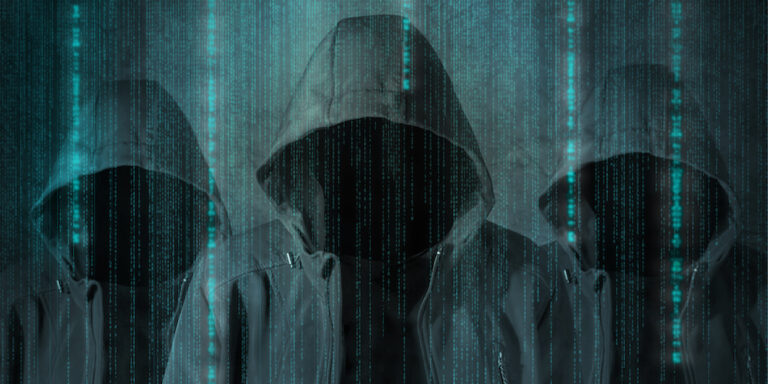 three hooded figures