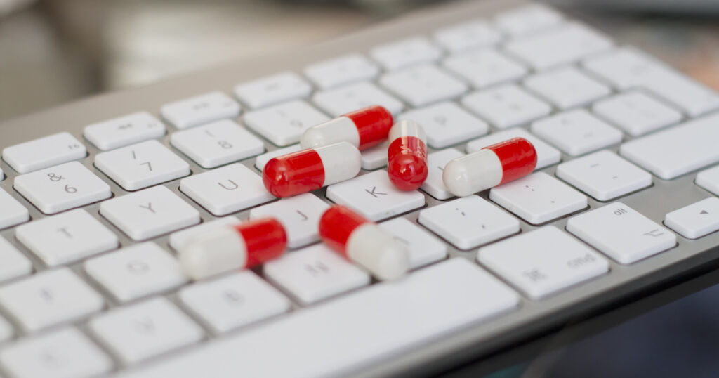 Pills on a computer keyboard