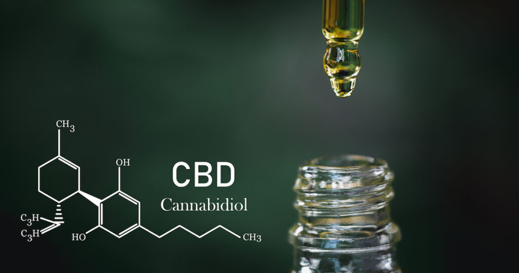 This is an image of CBD oil with the word 'CBD' on a dark background and a graphic of a chemical compound overlay.