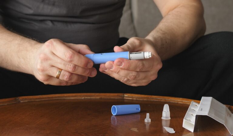 obese fat man preparing Semaglutide Ozempic injection control blood sugar levels