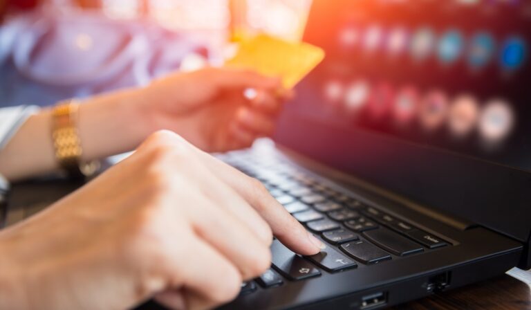 People Online shopping using credit card typing private information to shop in website.