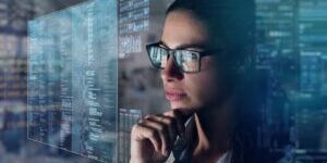 A business woman in his office reads financial news about the world economy on his futuristic newspaper in holography.