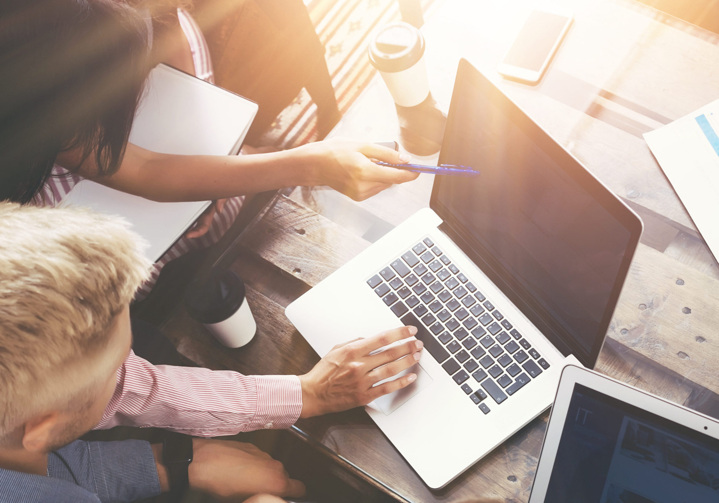 Group Young Coworkers Team Making Excellent Business Decisions.Creative People Group Young Coworkers Team Making Excellent Business Decisions.Creative People Discussion Corporate Work Concept Modern Office.New Startup Marketing Idea Presentation.Woman Touching Laptop.Flares